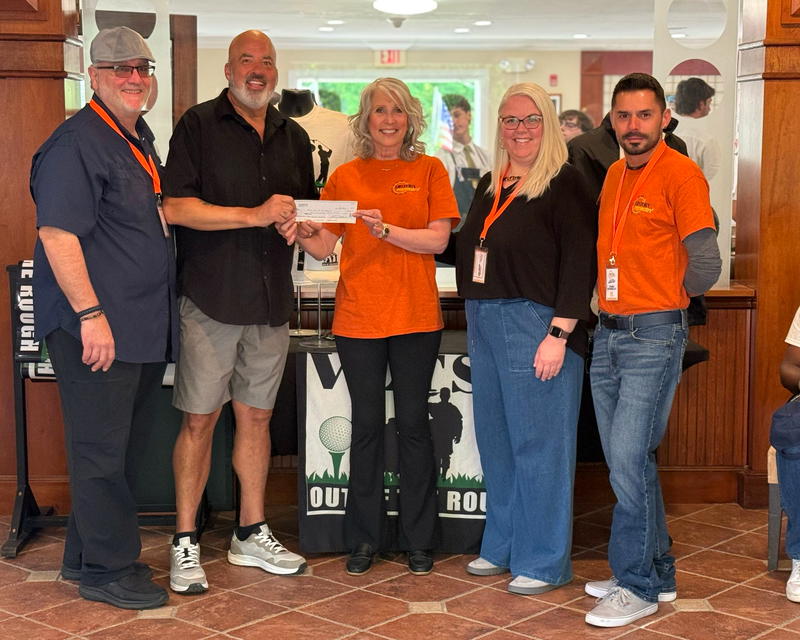 History Repeatn’s Carol Taylor, John Daniello, Peter Gallo, and Jessica Driscoll present a $500 donation to Veterans Out of the Rough, a nonprofit organization helping Long Island veterans through golf, camaraderie and connection.